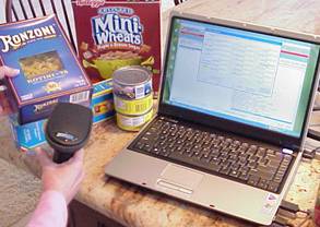 Photo of laptop with barcode scanner and food.